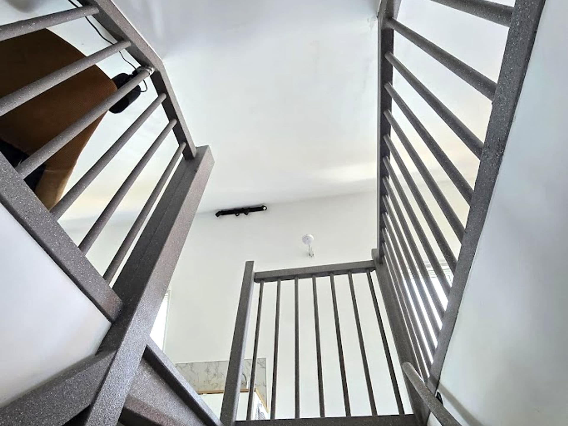 Open staircase bottom view with railing
